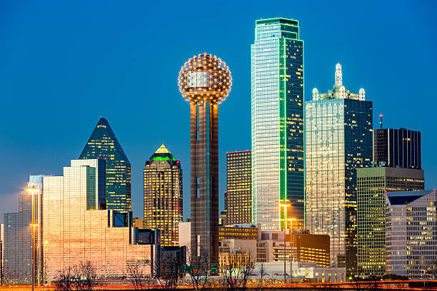 Dallas skyline at sunset under a clear blue sky
